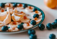 피로 회복을 위한 영양소와 운동 루틴 sliced of orange fruit on white and blue ceramic plate