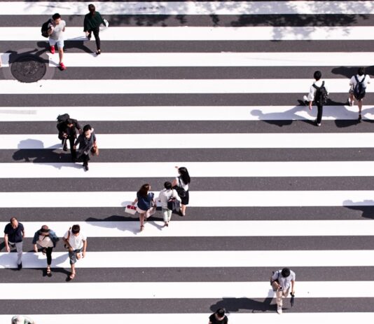 일상 속 걷기 습관, 건강을 지키는 작은 변화 aerial view photography of group of people walking on gray and white pedestrian lane