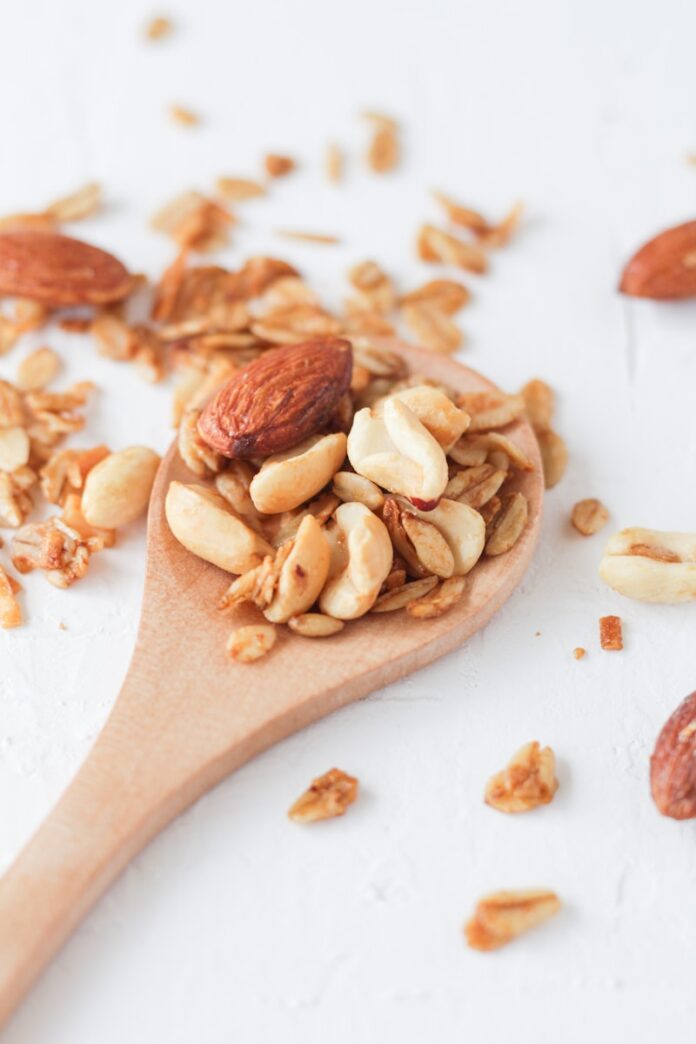 Photo by Fernanda Martinez brown wooden spoon with brown and white food
