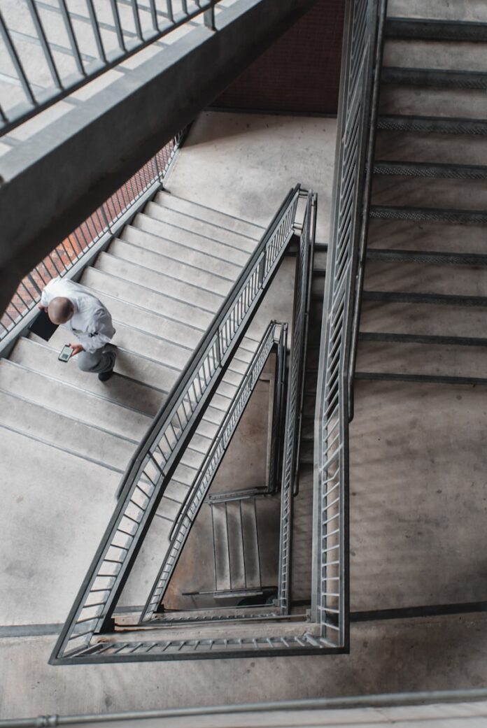 Photo by Matthew LeJune man walking upstairs